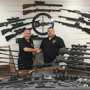 Display rack of rifles with instructors